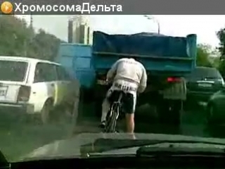a moron on a bike and in a traffic jam
