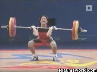 the weightlifter was offended by the weight of the barbell and she croaked angrily)))